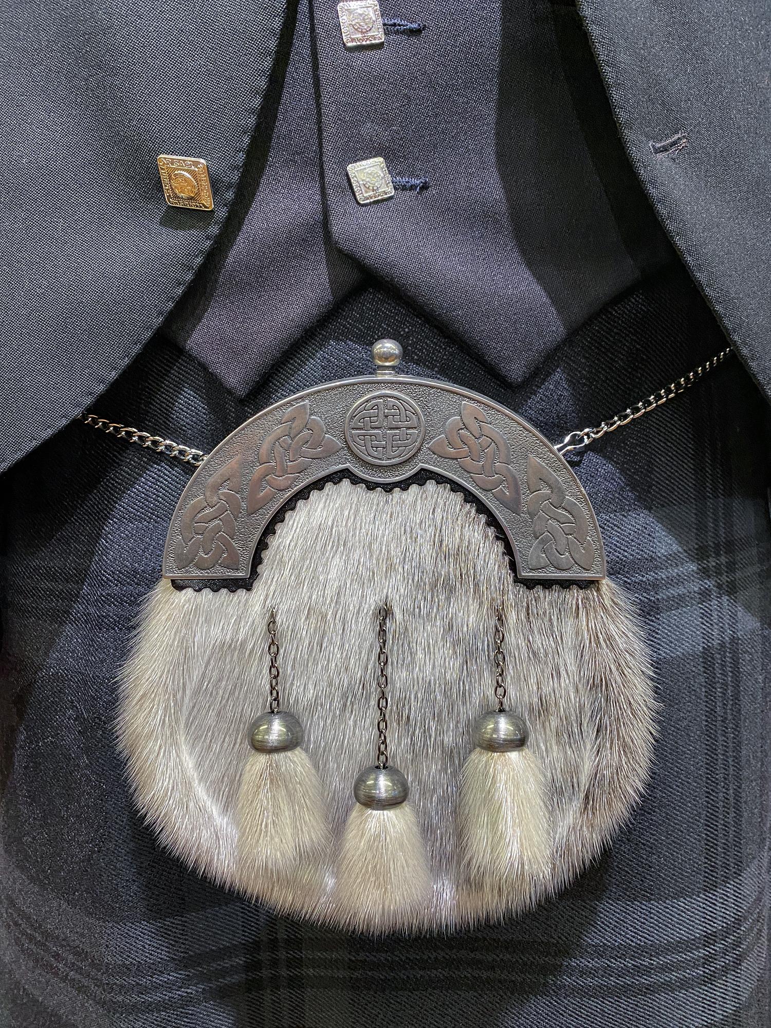 Jacket sleeve with dense emblem embroidery in metallic thread